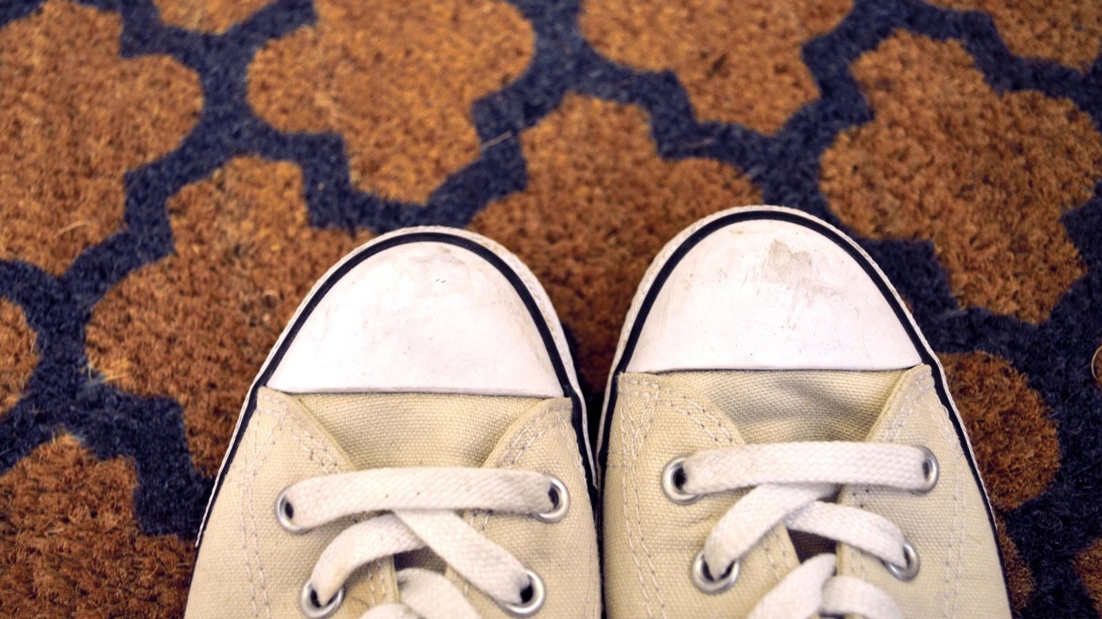 Clean and reset the entryway: Clean the doormat according to its material