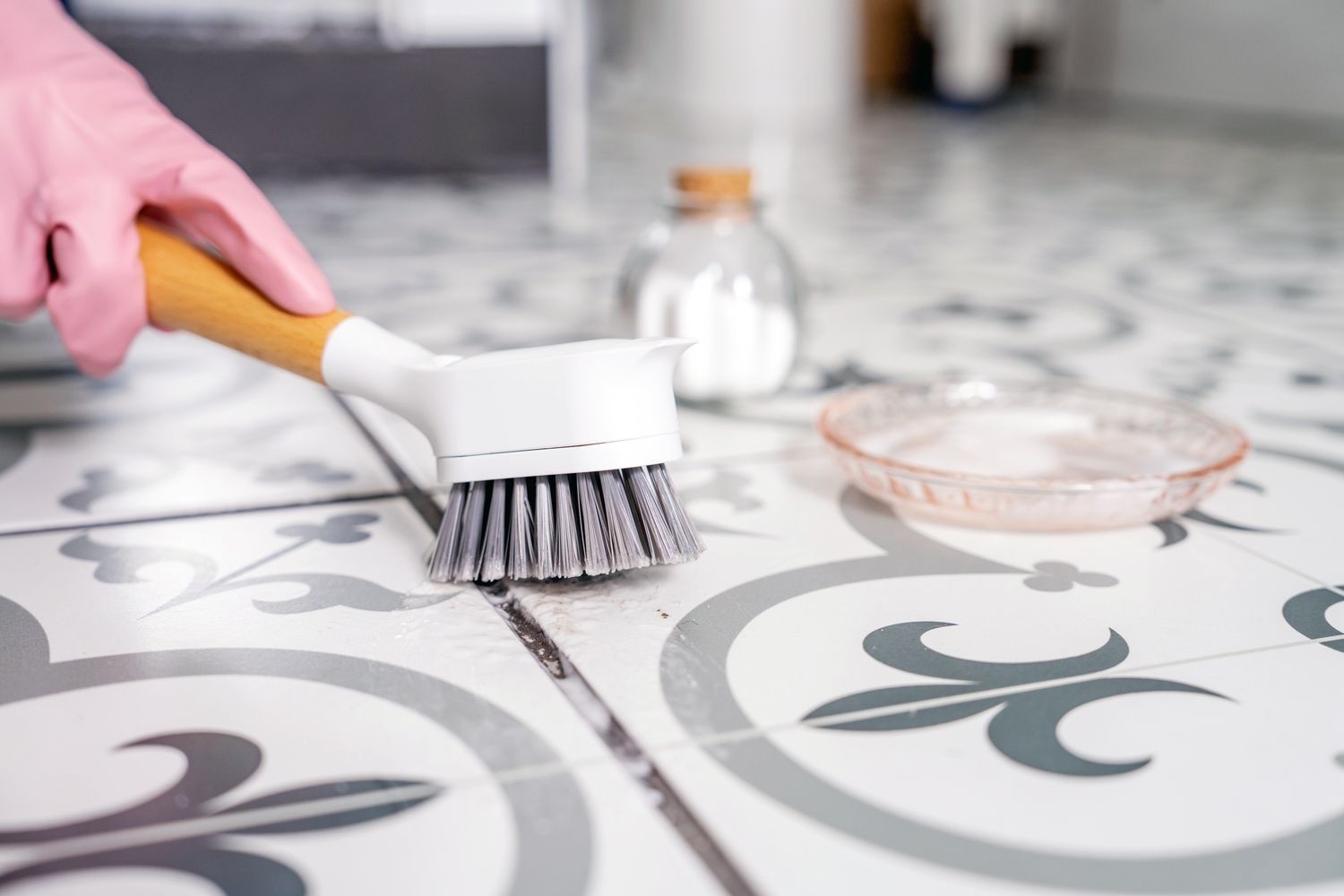 Create a repeatable bathroom cleaning routine: Clean bathroom floors with surface and exposure in mind